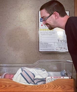 Dakota Brinkman with his newly born baby girl Ripley
